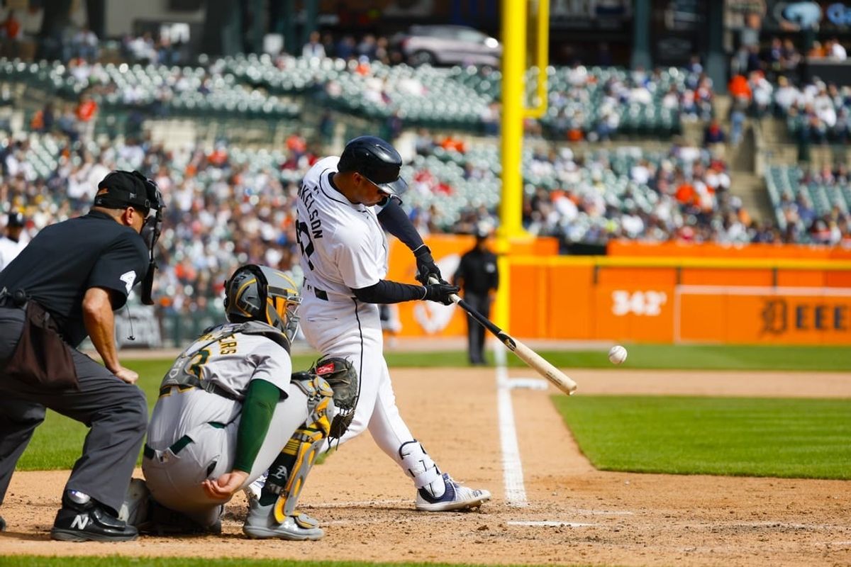Apr 7, 2024; Detroit, Michigan, USA; Detroit Tigers first baseman Spencer Torkelson (20) hits the ball during an at bat during the game against the Oakland Athletics at Comerica Park.