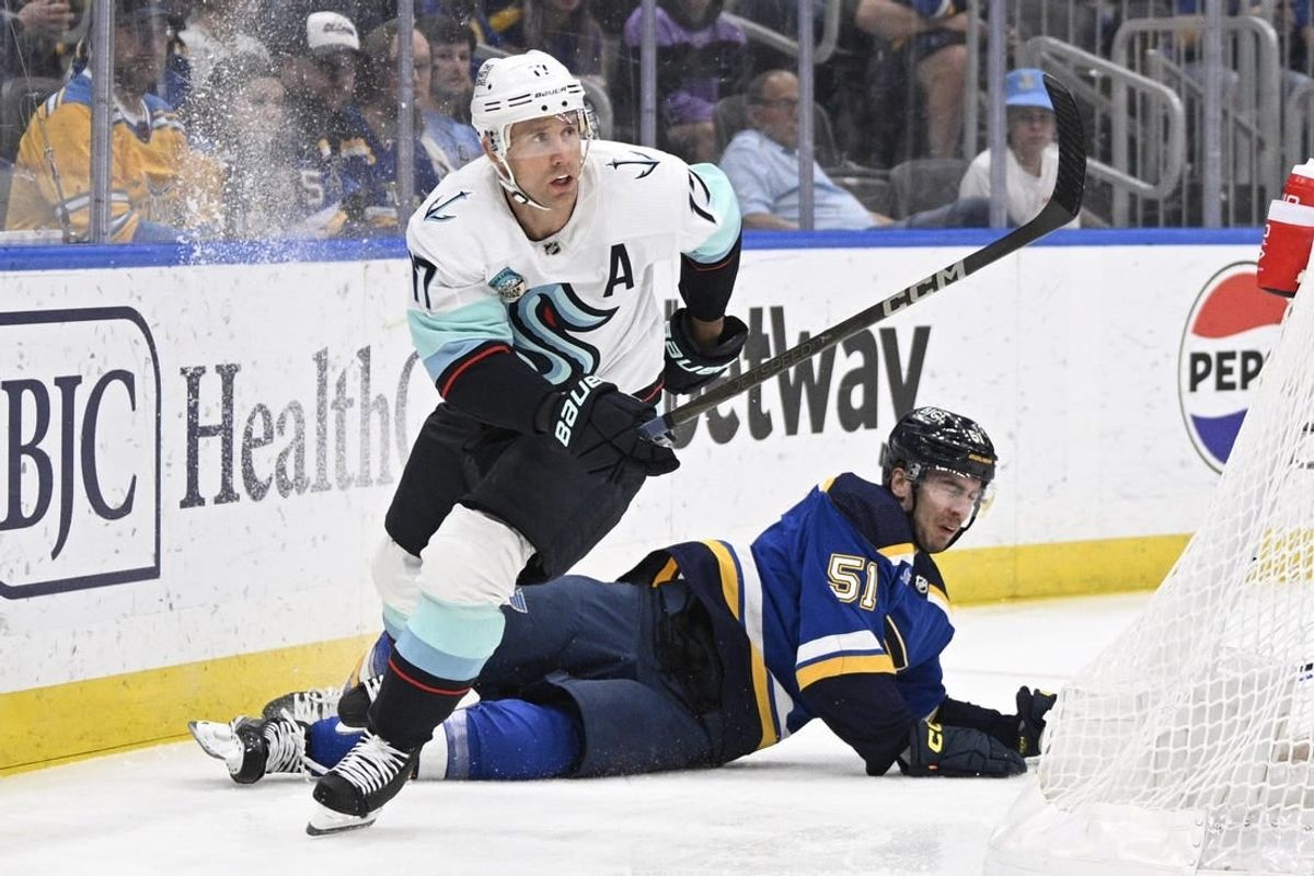 Apr 14, 2024; St. Louis, Missouri, USA; Seattle Kraken center Jaden Schwartz (17) collides with St. Louis Blues defenseman Matthew Kessel (51) during the first period at Enterprise Center.