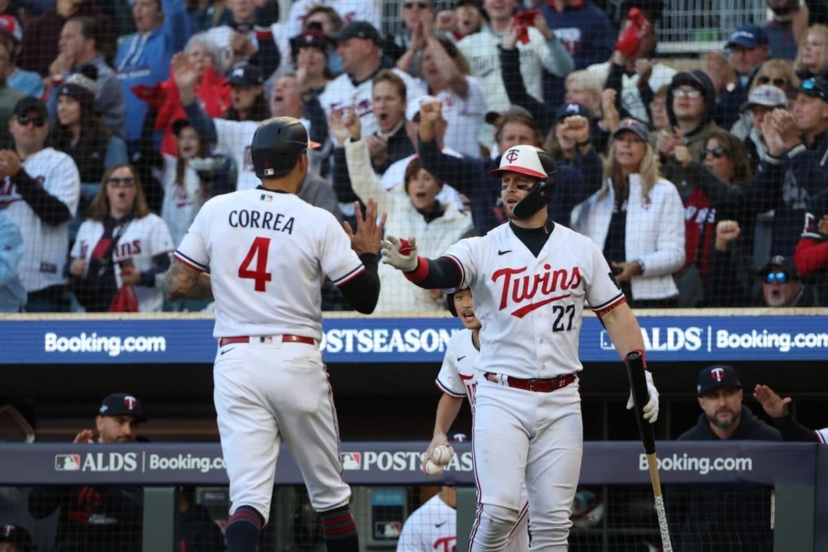 Oct 10, 2023; Minneapolis, Minnesota, USA; Minnesota Twins shortstop Carlos Correa (4) celebrates with catcher Ryan Jeffers (27) after scoring a run in the sixth inning against the Houston Astros during game three of the ALDS for the 2023 MLB playoffs at Target Field.