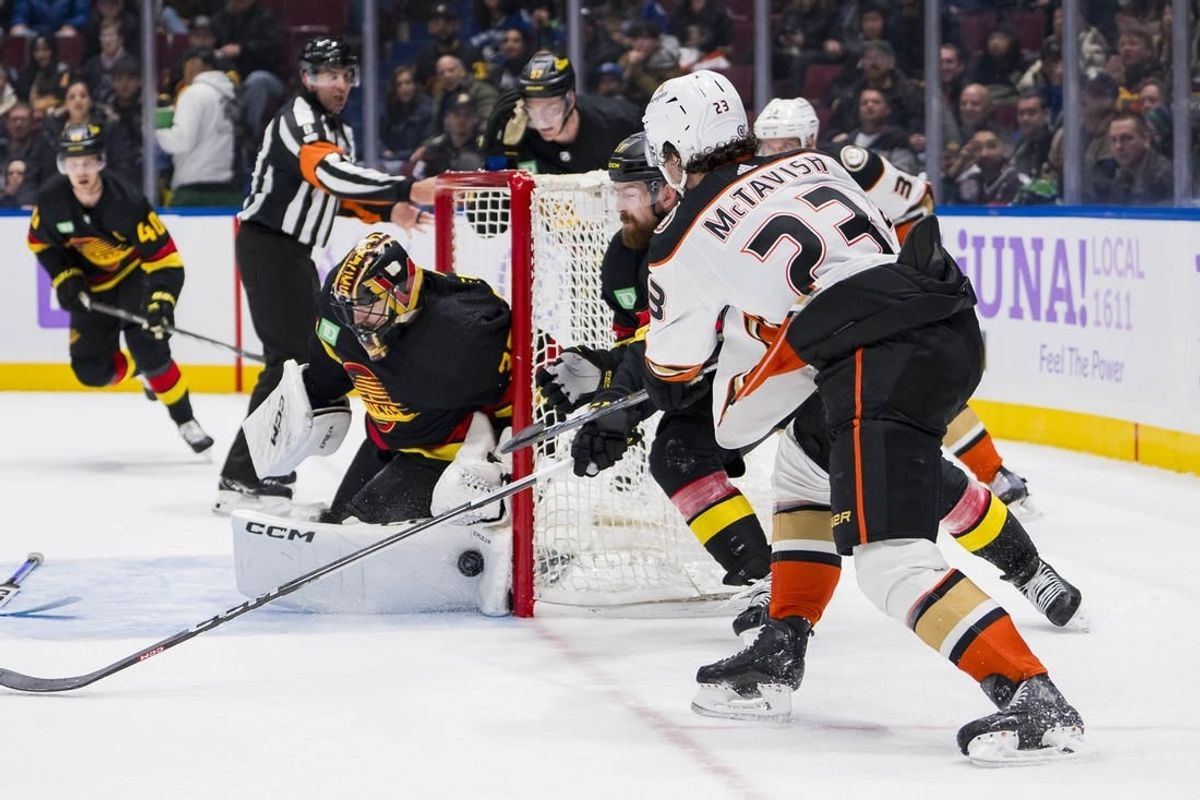 Nov 28, 2023; Vancouver, British Columbia, CAN; Vancouver Canucks goalie Thatcher Demko (35) makes a save on Anaheim Ducks forward Mason McTavish (23) in the third period at Rogers Arena. Vancouver won 3-1.