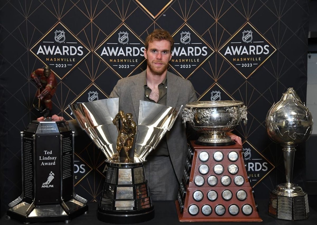 Jun 26, 2023; Nashville, Tennessee, USA; Edmonton Oilers center Connor McDavid poses with the (left to right) Ted Lindsay Award, Maurice \"Rocket\" Richard Trophy, Art Ross Trophy and Hart Memorial Trophy during the 2023 NHL Awards at Bridgestone Arena.