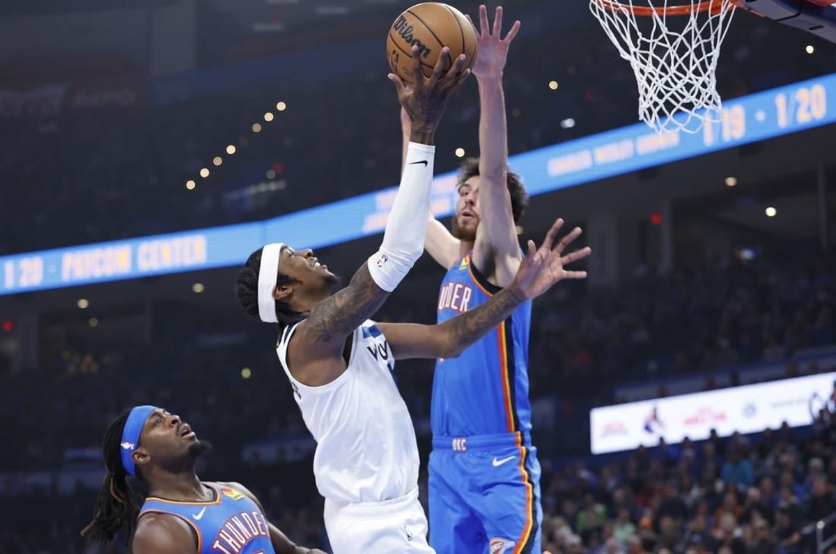 Dec 26, 2023; Oklahoma City, Oklahoma, USA; Minnesota Timberwolves forward Jaden McDaniels (3) is defended by Oklahoma City Thunder forward Chet Holmgren (7) on a shot during the first quarter at Paycom Center.
