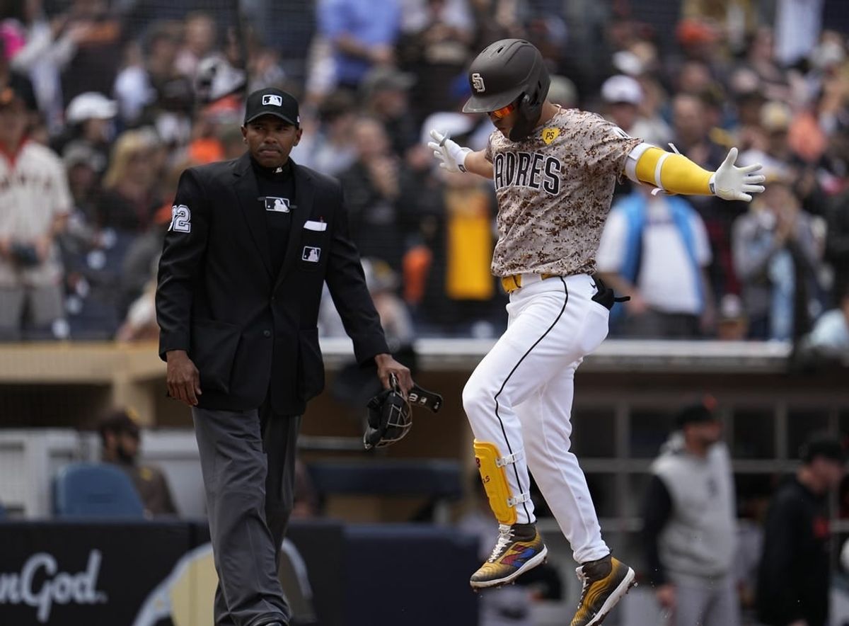 Mar 31, 2024; San Diego, California, USA; San Diego Padres shortstop Ha-Seong Kim (7) reacts after hitting a home run against the San Francisco Giants during the second inning at Petco Park.