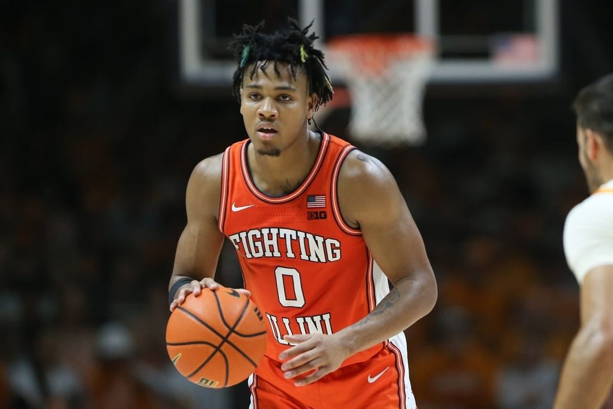 Dec 9, 2023; Knoxville, Tennessee, USA; Illinois Fighting Illini guard Terrence Shannon Jr. (0) brings the ball up court against the Tennessee Volunteers during the second half at Food City Center at Thompson Boling Arena.