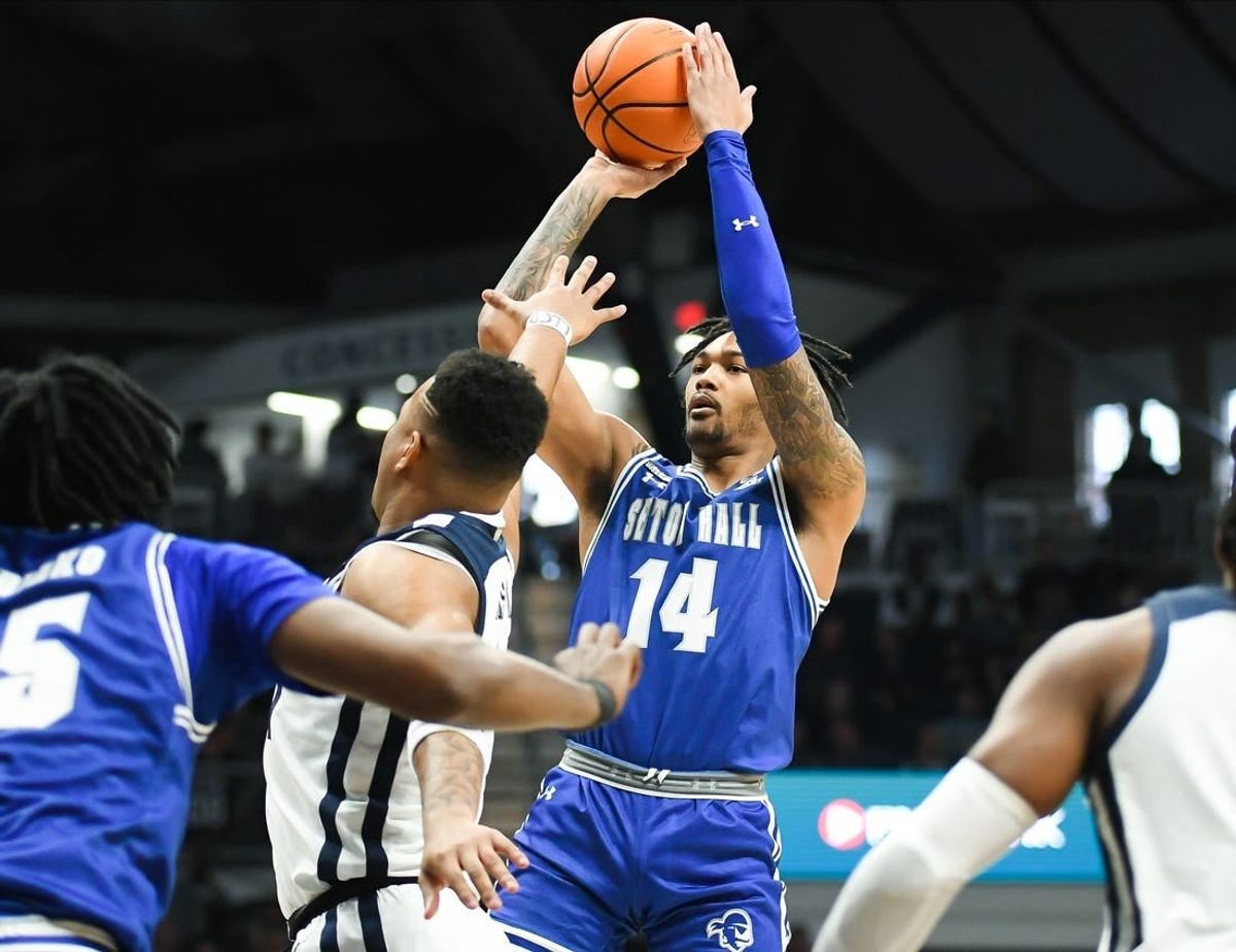 Jan 13, 2024; Indianapolis, Indiana, USA; Seton Hall Pirates guard Dre Davis (14) attempts a shot over Butler Bulldogs guard Pierre Brooks (21) during the first half at Hinkle Fieldhouse.