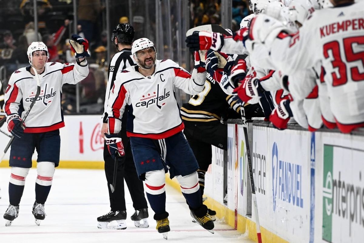 Feb 10, 2024; Boston, Massachusetts, USA; Washington Capitals left wing Alex Ovechkin (8) celebrates with his teammates after scoring a goal against the Boston Bruins during the third period at the TD Garden.