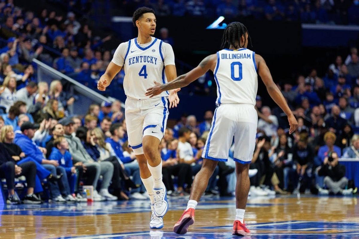 Nov 10, 2023; Lexington, Kentucky, USA; Kentucky Wildcats forward Tre Mitchell (4) fives guard Rob Dillingham (0) during the first half against the Texas A&M Commerce Lions at Rupp Arena at Central Bank Center.