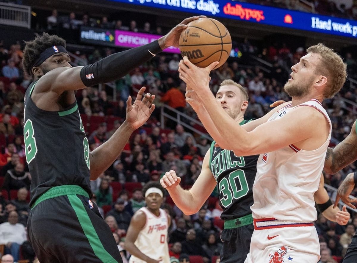 Jan 21, 2024; Houston, Texas, USA;  Boston Celtics center Neemias Queta (88) and Houston Rockets center Jock Landale (2) fight over a rebound in the second quarter at Toyota Center.