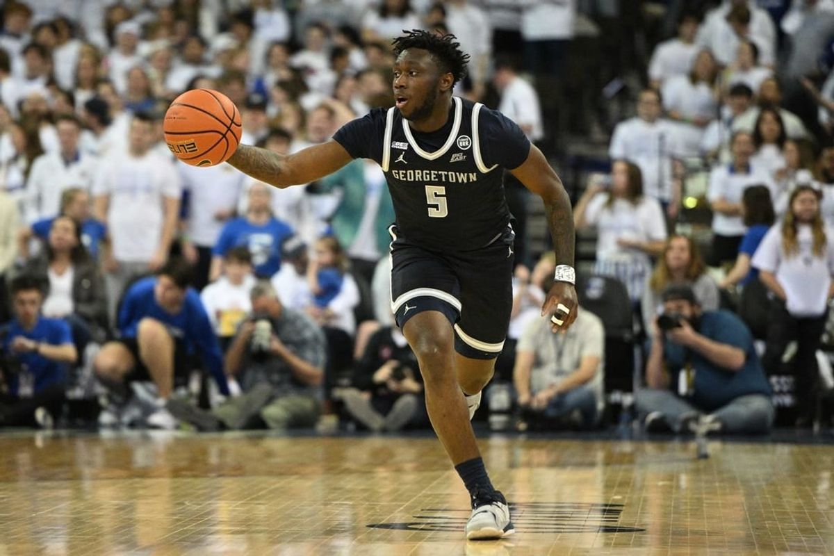 Mar 1, 2023; Omaha, Nebraska, USA;  Georgetown Hoyas guard Jay Heath (5) dribbles against the Creighton Bluejays in the first half at CHI Health Center Omaha.