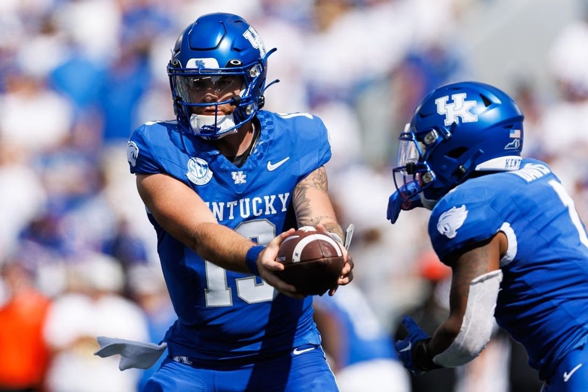 Sep 30, 2023; Lexington, Kentucky, USA; Kentucky Wildcats quarterback Devin Leary (13) hands the ball to running back Ray Davis (1) during the second quarter against the Florida Gators at Kroger Field.