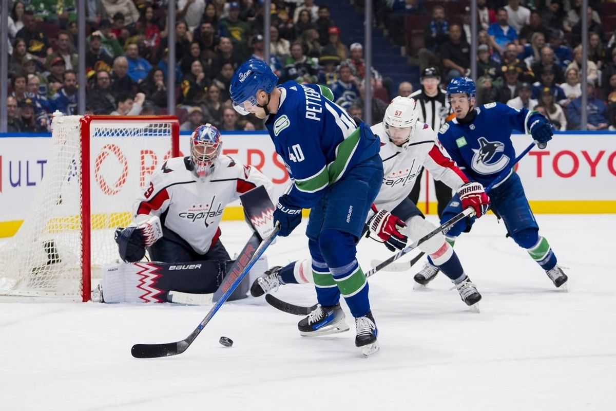 Mar 16, 2024; Vancouver, British Columbia, CAN; Vancouver Canucks forward Elias Pettersson (40) handles the puck against the Washington Capitals in the third period at Rogers Arena. Washington won 2 -1.