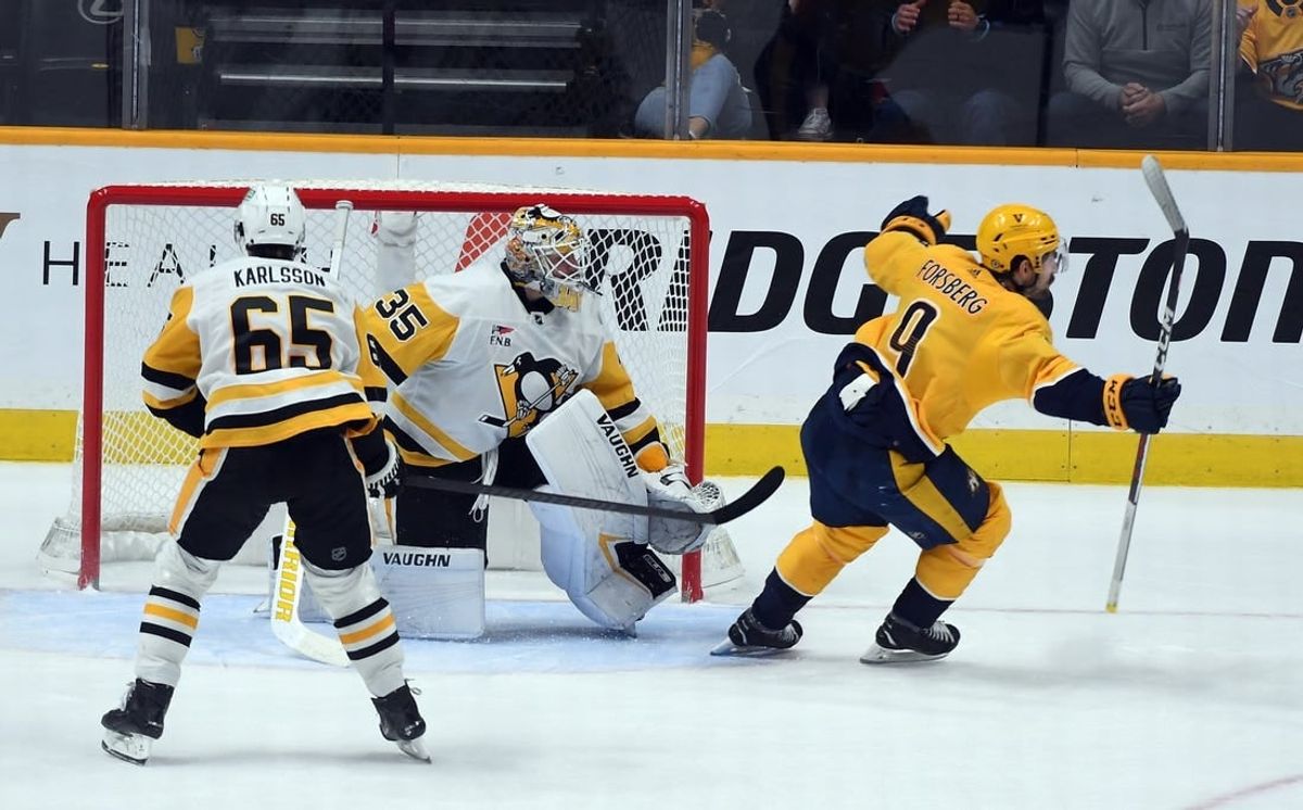 Nov 28, 2023; Nashville, Tennessee, USA; Nashville Predators left wing Filip Forsberg (9) scores the game-winning goal against Pittsburgh Penguins goaltender Tristan Jarry (35) in overtime at Bridgestone Arena.
