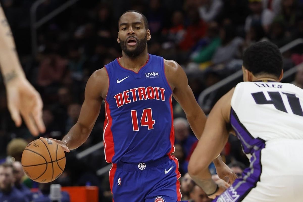 Jan 9, 2024; Detroit, Michigan, USA;  Detroit Pistons guard Alec Burks (14) dribbles defended by Sacramento Kings forward Trey Lyles (41) in the second half at Little Caesars Arena.