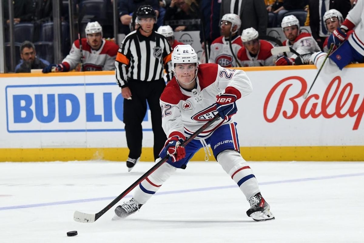 Mar 5, 2024; Nashville, Tennessee, USA; Montreal Canadiens right wing Cole Caufield (22) passes the puck during the second period against the Nashville Predators at Bridgestone Arena.