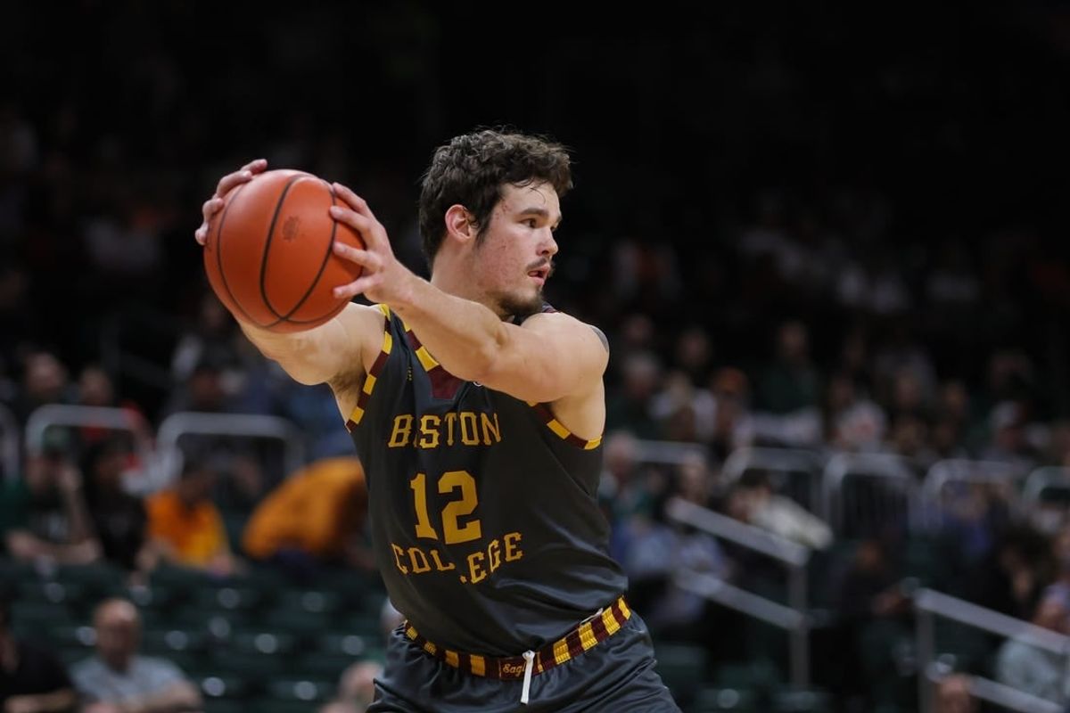 Mar 6, 2024; Coral Gables, Florida, USA; Boston College Eagles forward Quinten Post (12) controls the basketball against the Miami Hurricanes during the second half at Watsco Center.