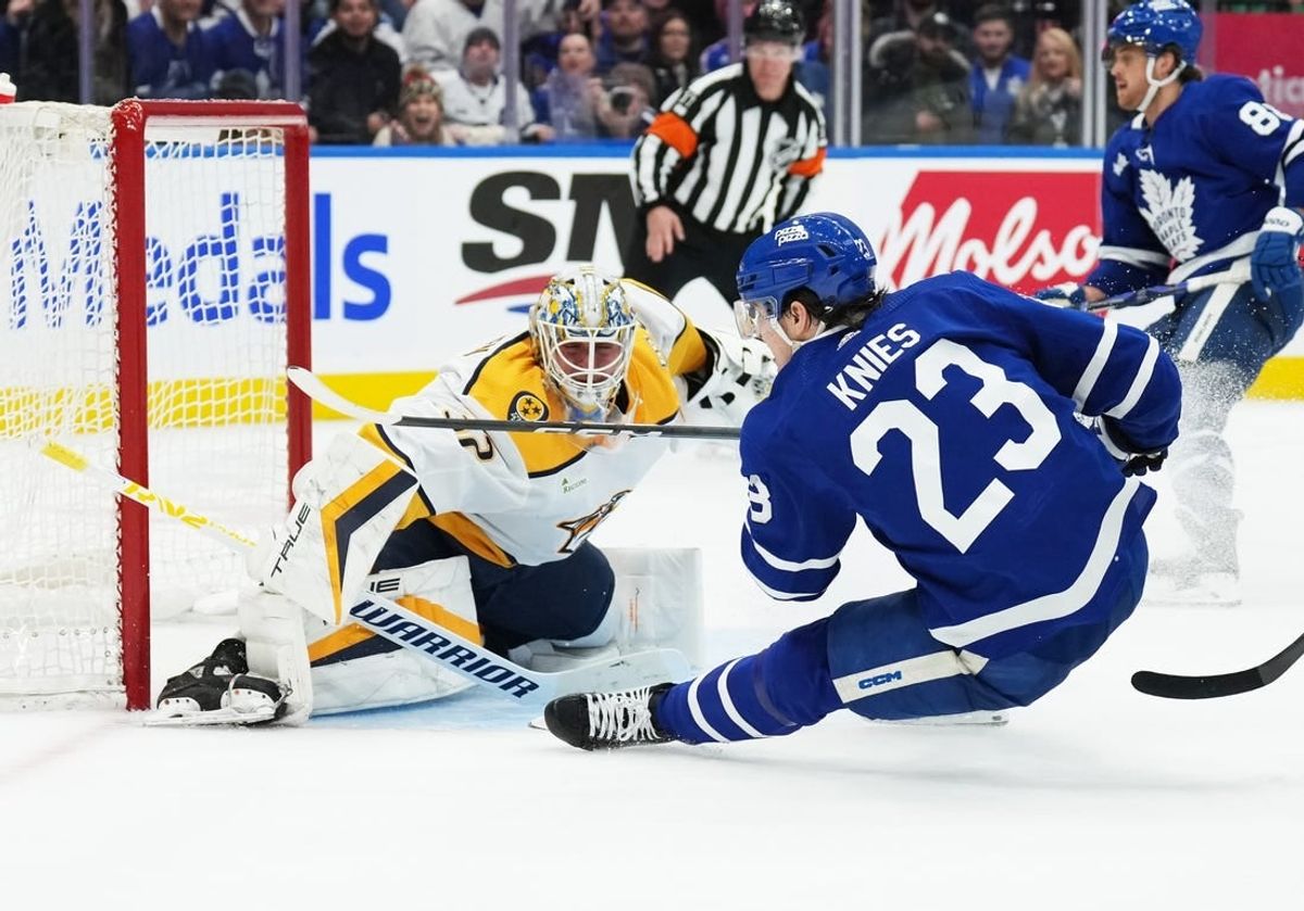 Dec 9, 2023; Toronto, Ontario, CAN; Toronto Maple Leafs left wing Matthew Knies (23) attempts a shot on Nashville Predators goaltender Kevin Lankinen (32) during the third period at Scotiabank Arena.