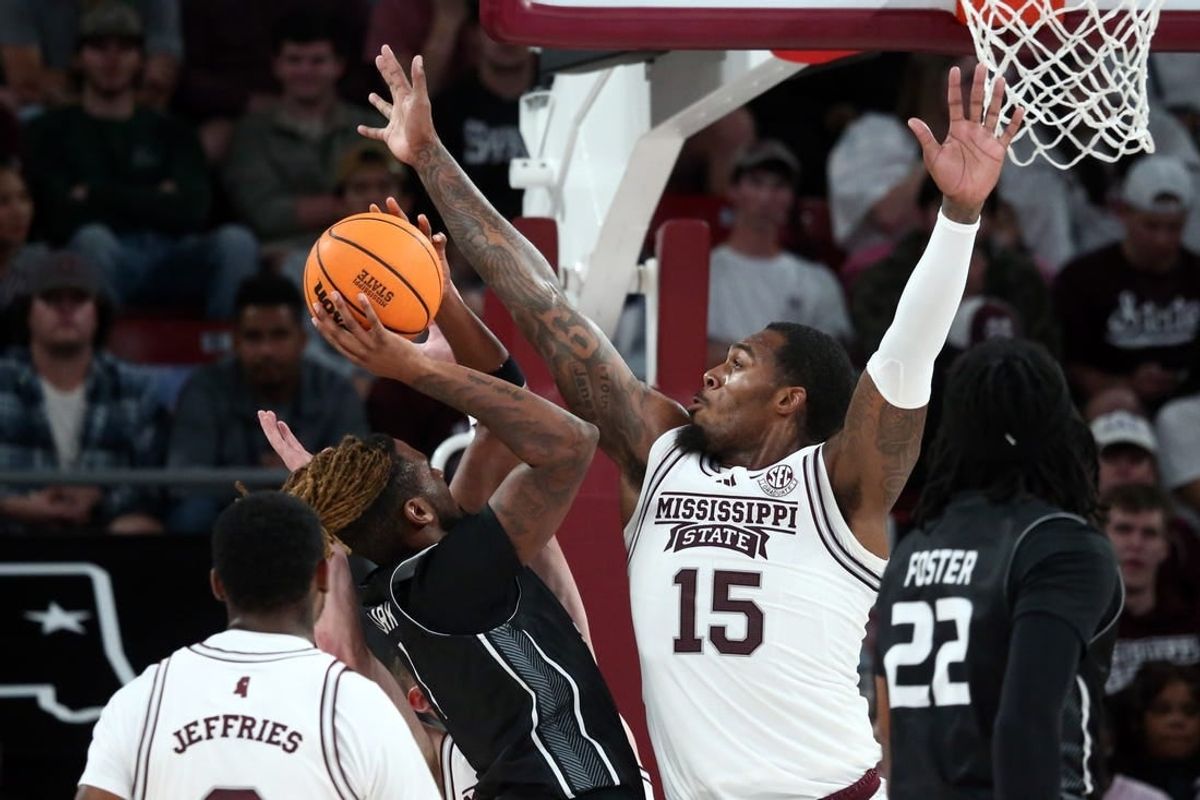 Nov 14, 2023; Starkville, Mississippi, USA; Mississippi State Bulldogs forward Jimmy Bell Jr. (15) defends as North Alabama Lions guard Micah Clark (1) shoots during the first half at Humphrey Coliseum.