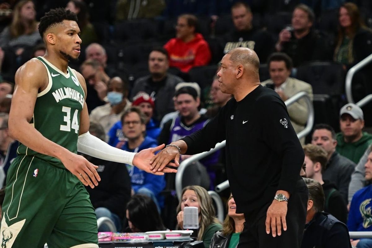 Apr 3, 2024; Milwaukee, Wisconsin, USA; Milwaukee Bucks head coach Doc Rivers greets forward Giannis Antetokounmpo (34) in the fourth quarter against the Memphis Grizzlies at Fiserv Forum.