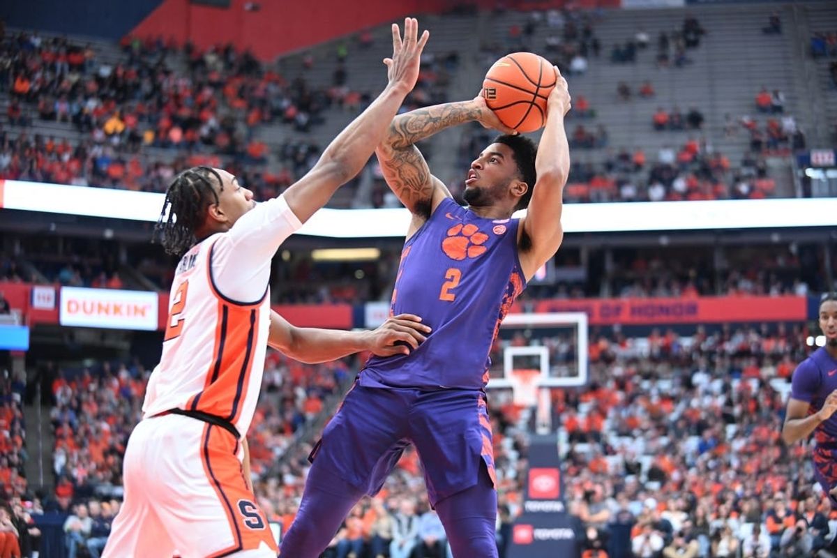 Feb 10, 2024; Syracuse, New York, USA; Clemson Tigers guard Dillon Hunter (2) shoots over Syracuse Orange guard JJ Starling in the first half at the JMA Wireless Dome.