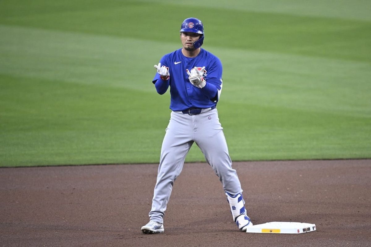 Apr 8, 2024; San Diego, California, USA; Chicago Cubs designated hitter Seiya Suzuki (27) celebrates after hitting a double against the San Diego Padres during the first inning at Petco Park.