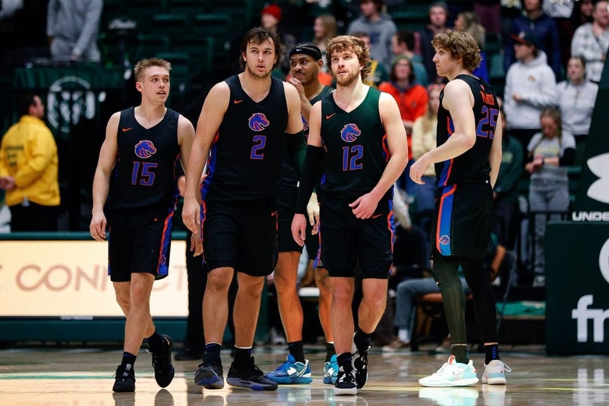 Boise State Broncos guard Jace Whiting (15), forward Tyson Degenhart (2) and guard Max Rice (12) and center Lukas Milner (25) in the second half against the Colorado State Rams at Moby Arena.