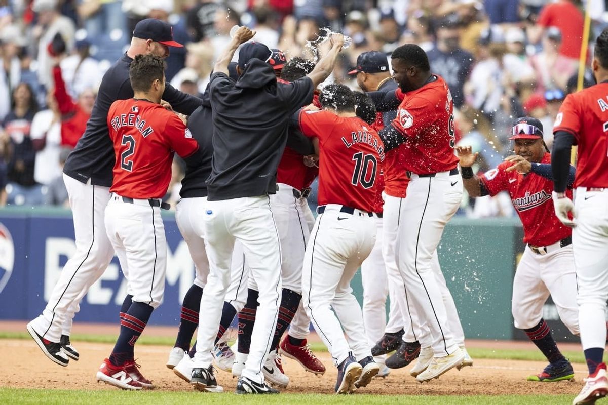 Apr 14, 2024; Cleveland, Ohio, USA; The Cleveland Guardians celebrate their tenth inning winning against the New York Yankees at Progressive Field.