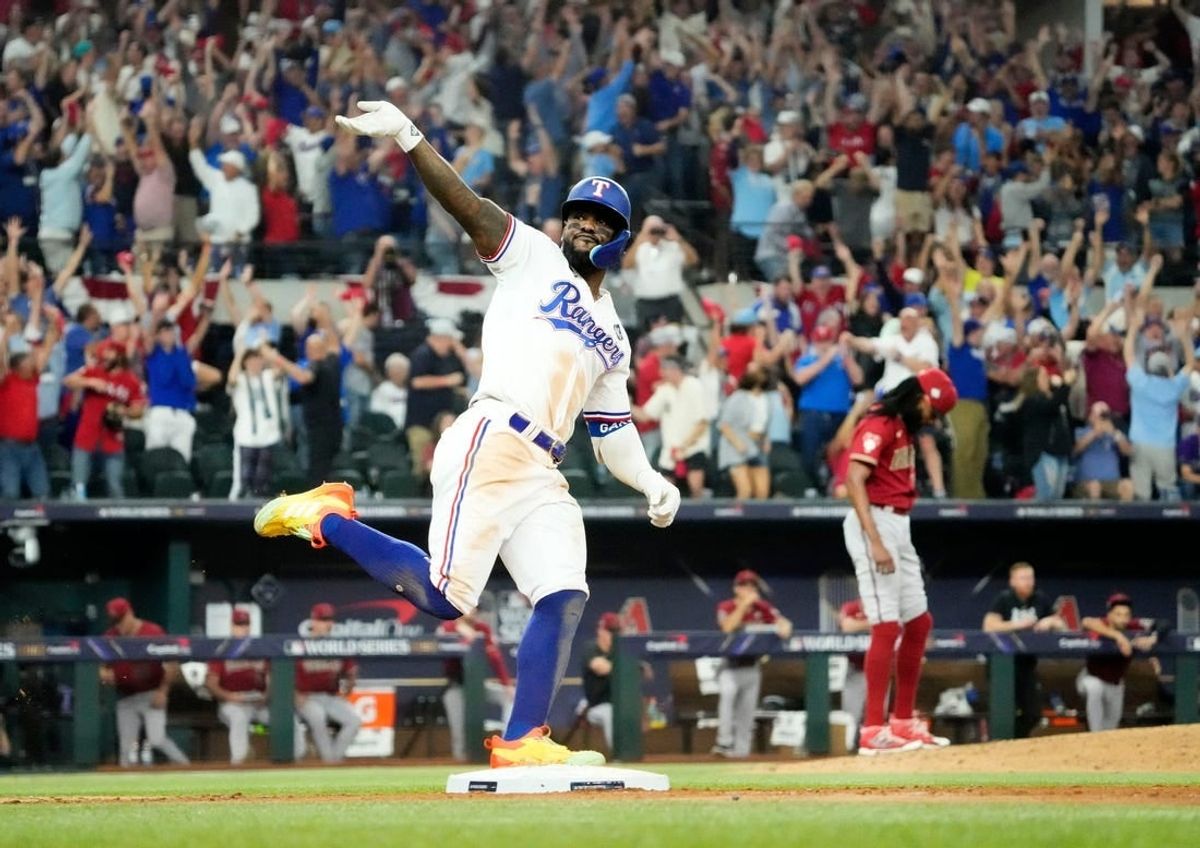 Oct 27, 2023; Arlington, Texas, USA; Texas Rangers Adolis Garcia (53) hits a walk-off home run off Arizona Diamondbacks relief pitcher Miguel Castro (50) in the 11th inning during Game 1 of 2023 World Series at Globe Life Field.