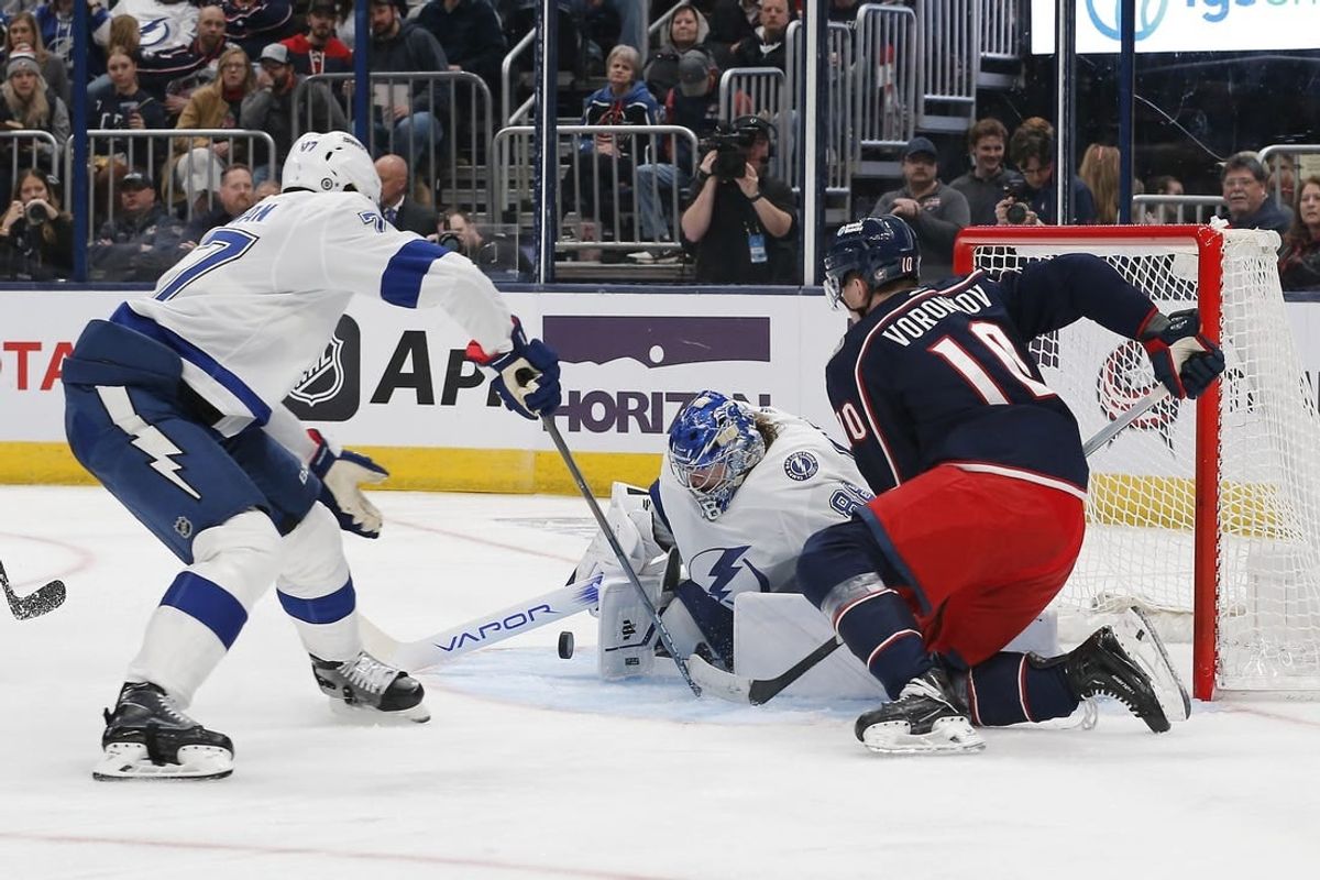 Feb 10, 2024; Columbus, Ohio, USA; Tampa Bay Lightning goalie Andrei Vasilevskiy (88) makes a save as Columbus Blue Jackets left wing Dmitri Voronkov (10) looks for a rebound during the second period at Nationwide Arena.