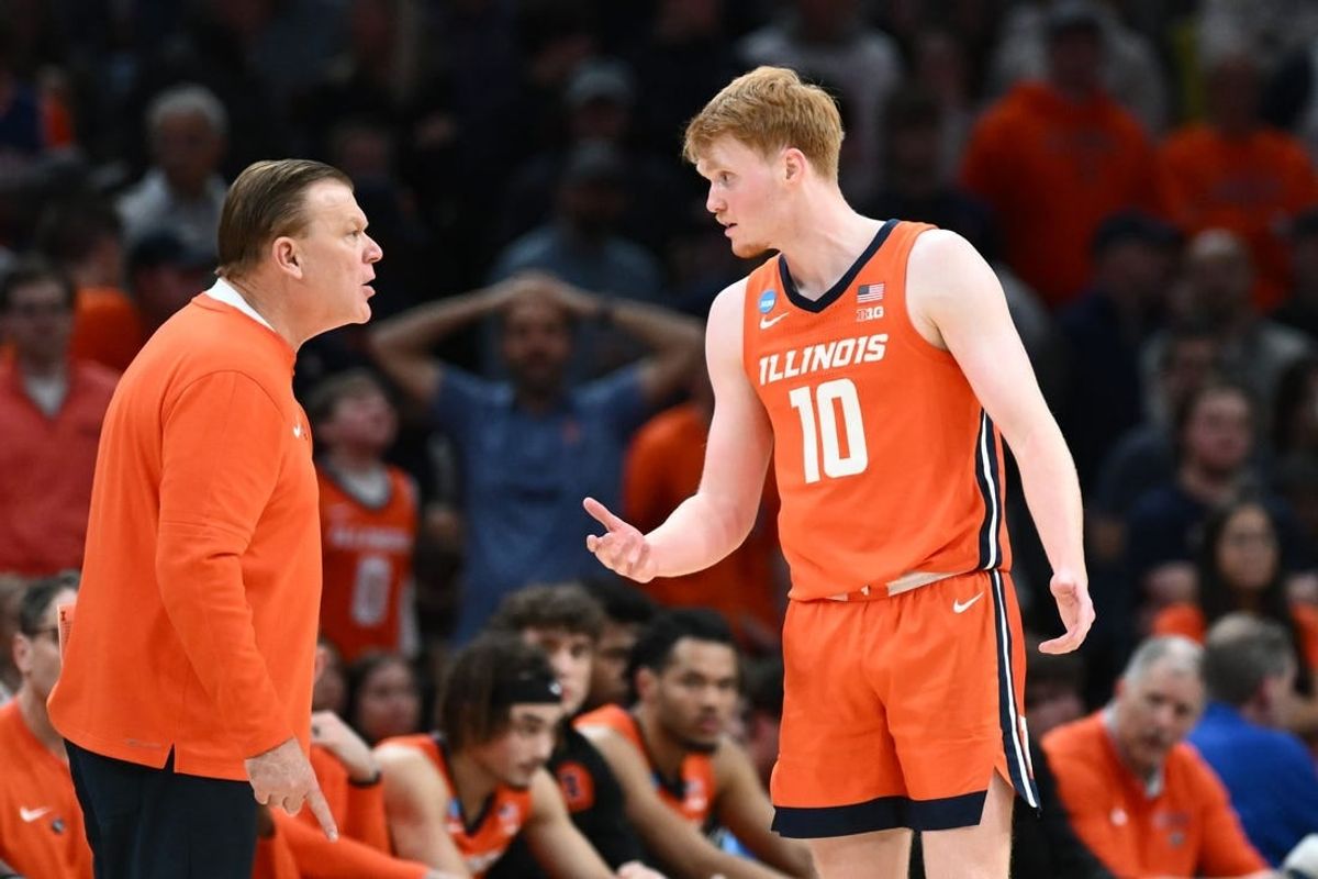 Illinois Fighting Illini guard Luke Goode (10) talks with head coach Brad Underwood in the finals of the East Regional of the 2024 NCAA Tournament at TD Garden.