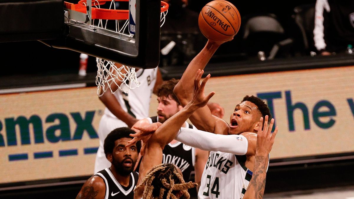 Giannis Antetokounmpo of the Milwaukee Bucks shoots over Nicolas Claxton of the Brooklyn Nets during the second quarter during Game One of the Eastern Conference second-round  series at Barclays Center on June 05, 2021,  in New York City.