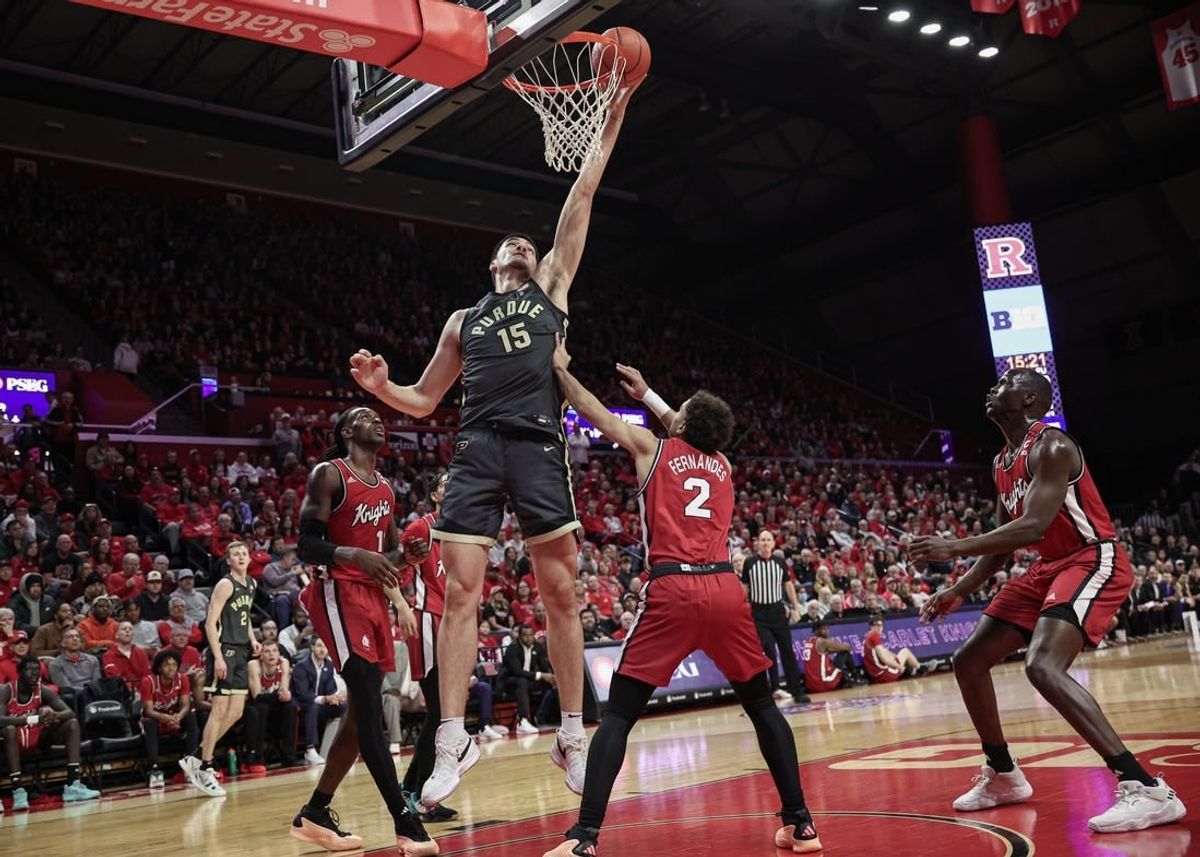 Jan 28, 2024; Piscataway, New Jersey, USA; Purdue Boilermakers center Zach Edey (15) lays the ball in for a basket during the first half in front of Rutgers Scarlet Knights center Clifford Omoruyi (11) and guard Noah Fernandes (2) at Jersey Mike's Arena.