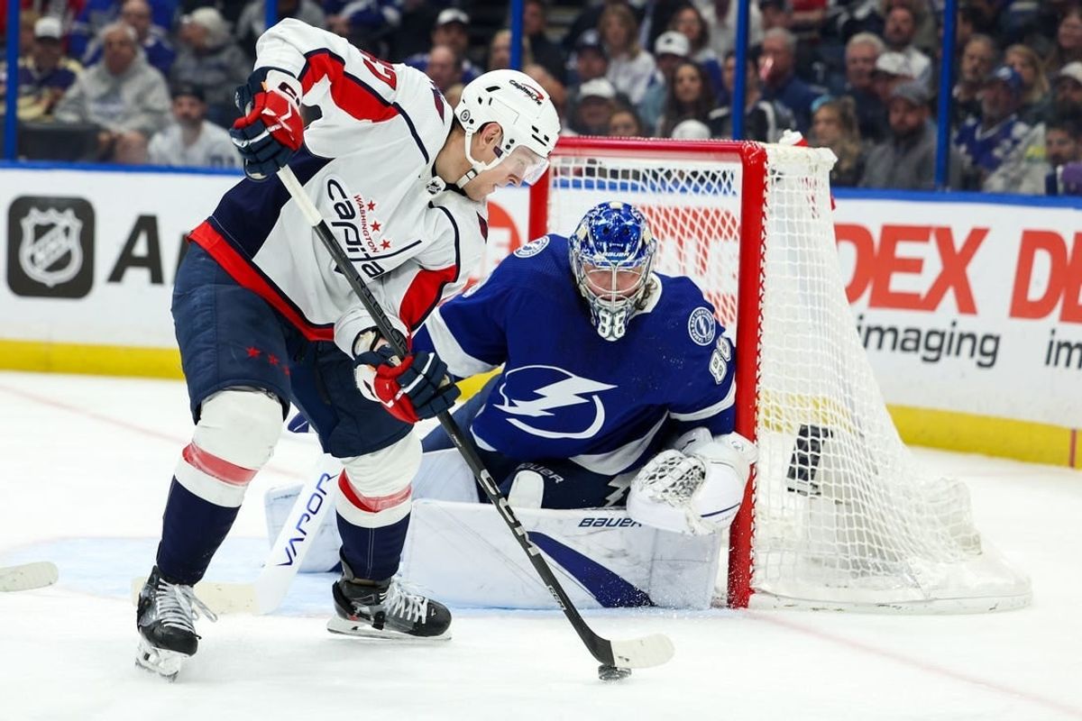Feb 22, 2024; Tampa, Florida, USA;  Washington Capitals left wing Beck Malenstyn (47) controls the puck in front of the goal against the Tampa Bay Lightning in the second period at Amalie Arena.