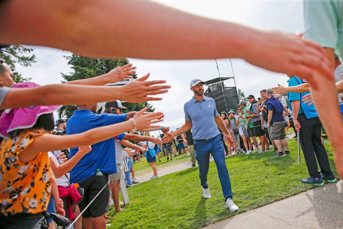 Outstretched arms for Dustin Johnson.