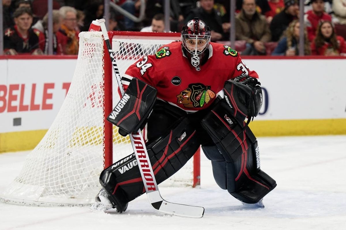 Jan 13, 2024; Chicago, Illinois, USA;  Chicago Blackhawks goaltender Petr Mrazek (34) defends the net against the Dallas Stars at United Center.