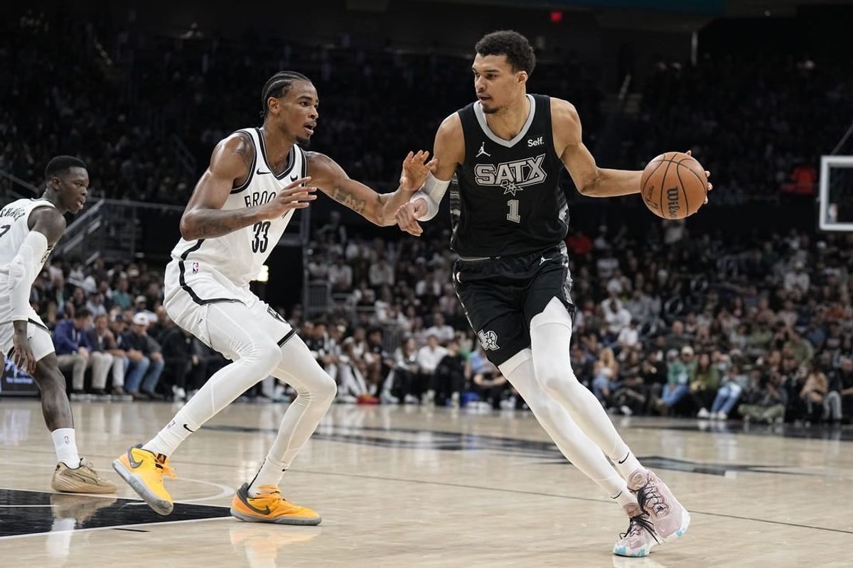 Mar 17, 2024; Austin, Texas, USA; San Antonio Spurs forward Victor Wembanyama (1) drives to the basket while defended by Brooklyn Nets center Nicolas Claxton (33) during the first half at Moody Center.