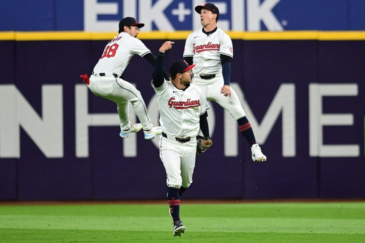 Apr 19, 2024; Cleveland, Ohio, USA; Cleveland Guardians center fielder Tyler Freeman (2) and left fielder Steven Kwan (38) and right fielder Will Brennan (17) celebrate after the Guardians beat the Oakland Athletics at Progressive Field.