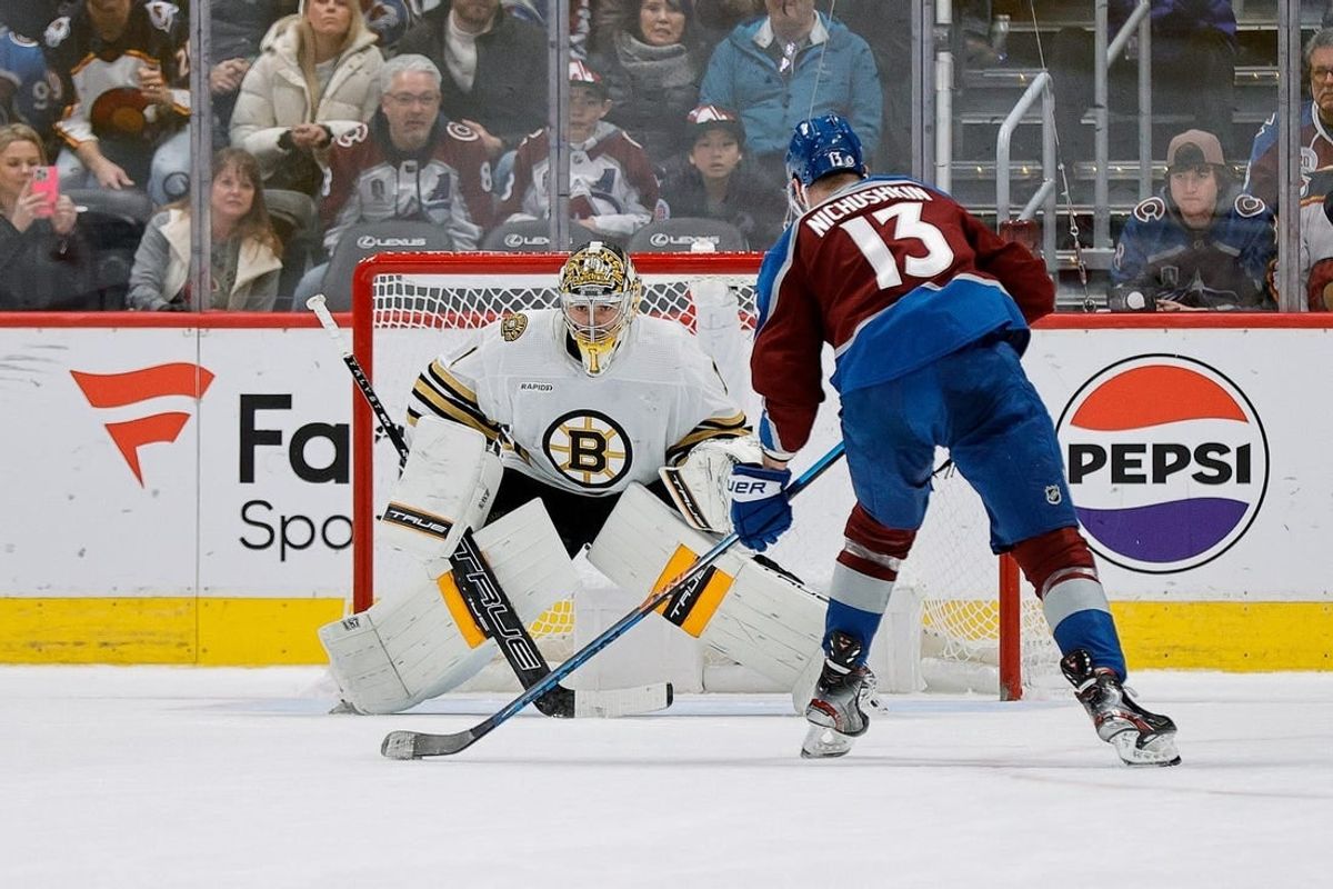 Jan 8, 2024; Denver, Colorado, USA; Colorado Avalanche right wing Valeri Nichushkin (13) scores the game winning shootout goal against Boston Bruins goaltender Jeremy Swayman (1) at Ball Arena.