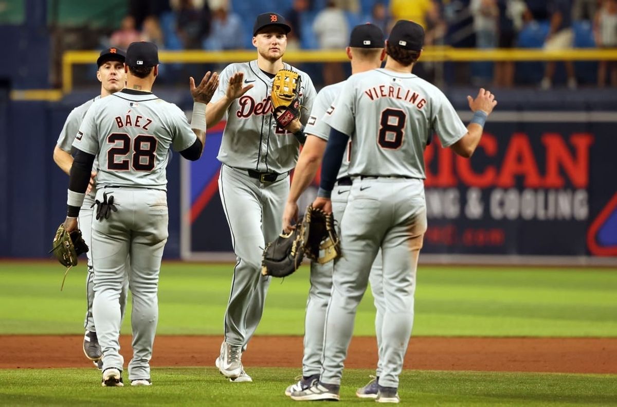 Apr 22, 2024; St. Petersburg, Florida, USA; Detroit Tigers outfielder Mark Canha (21), shortstop Javier Baez (28), outfielder Matt Vierling (8) and teammates celebrate as they beat the Tampa Bay Rays  at Tropicana Field.