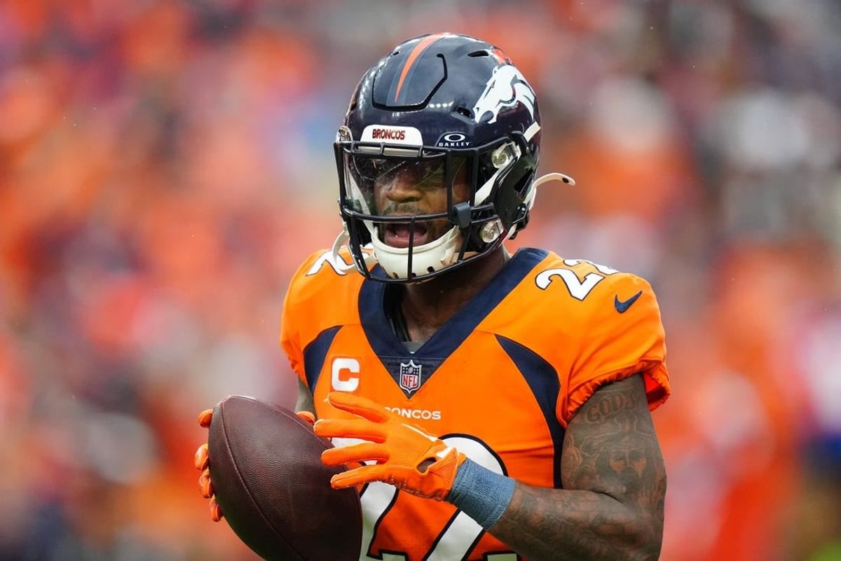 Sep 10, 2023; Denver, Colorado, USA; Denver Broncos safety Kareem Jackson (22) celebrates his turnover in the third quarter against the Las Vegas Raiders at Empower Field at Mile High.