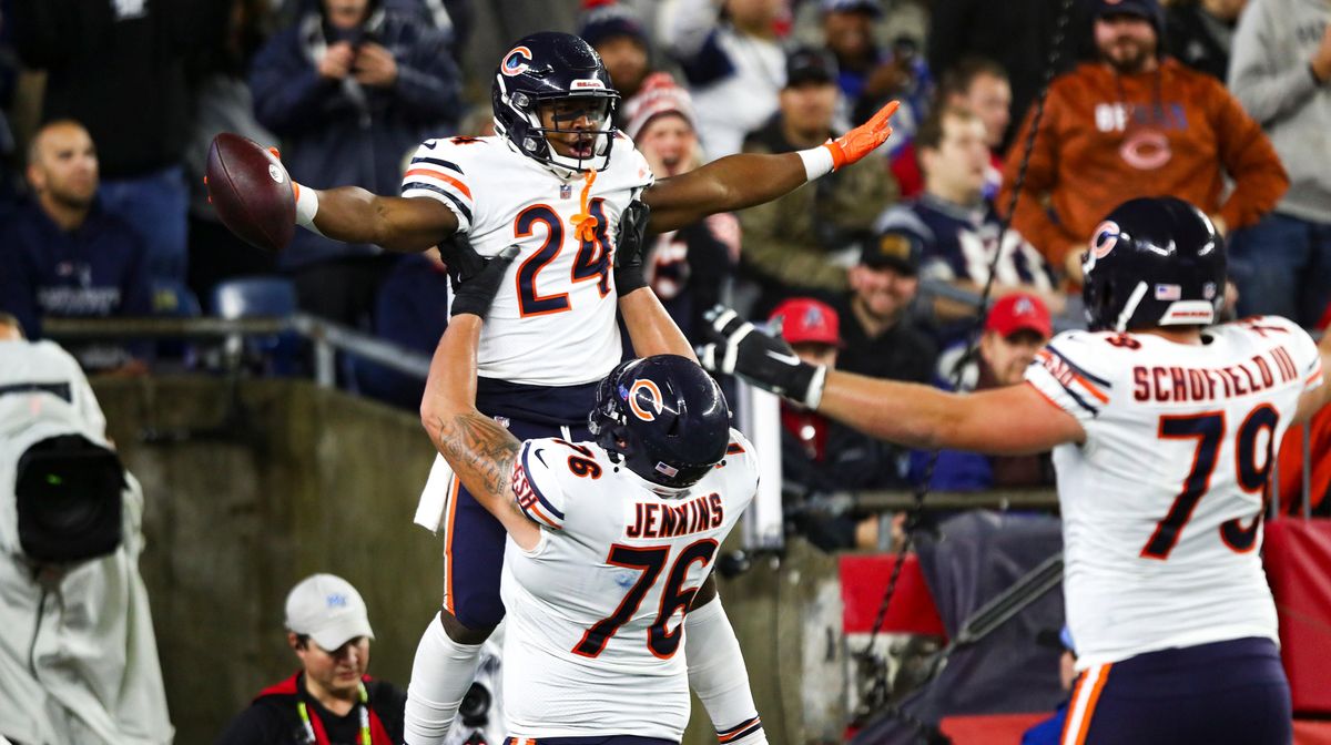 Khalil Herbert celebrates with his teammates after a touchdown