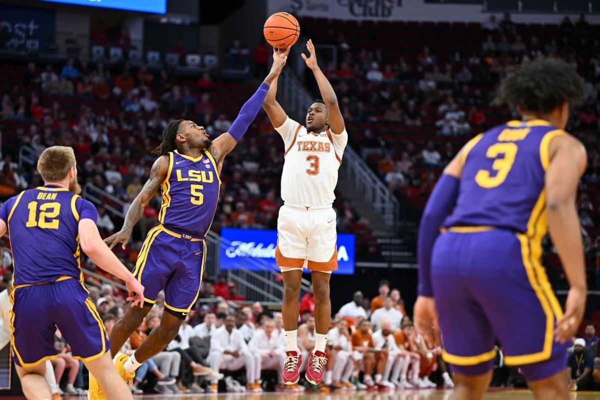 Dec 16, 2023; Houston, Texas, USA; Texas Longhorns guard Max Abmas (3) shoots the ball against LSU Tigers forward Mwani Wilkinson (5) during the first half at Toyota Center.