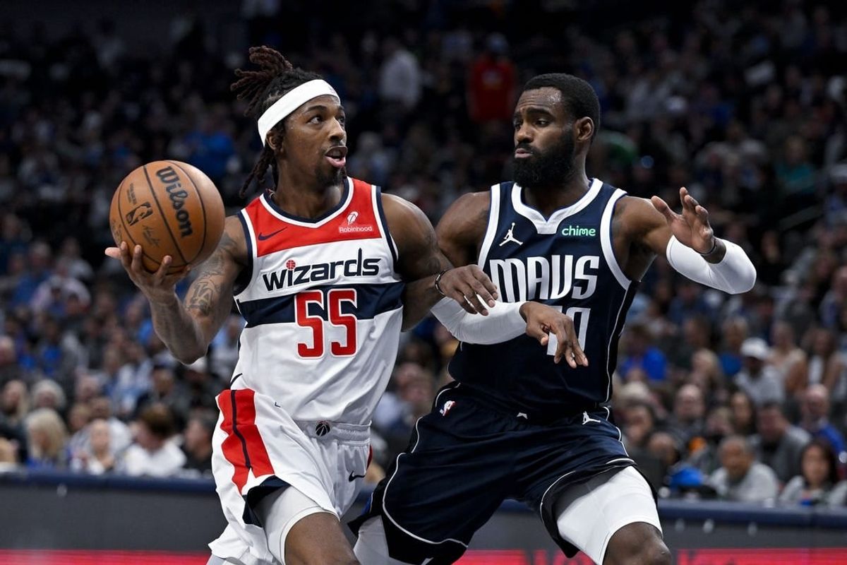 Feb 12, 2024; Dallas, Texas, USA; Washington Wizards guard Delon Wright (55) drives to the basket past Dallas Mavericks forward Tim Hardaway Jr. (10) during the second quarter at the American Airlines Center.