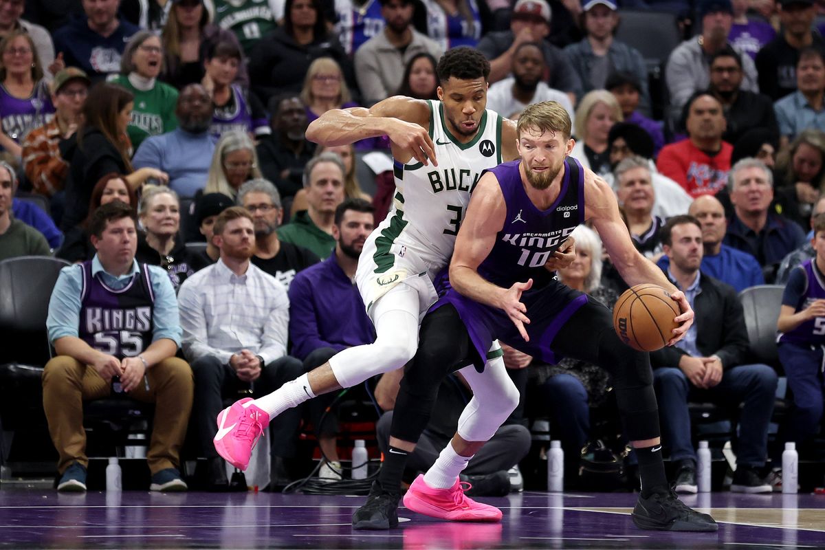 SACRAMENTO, CALIFORNIA - MARCH 12: Domantas Sabonis #10 of the Sacramento Kings is guarded by Giannis Antetokounmpo #34 of the Milwaukee Bucks at Golden 1 Center on March 12, 2024 in Sacramento, California. NOTE TO USER: User expressly acknowledges and agrees that, by downloading and or using this photograph, User is consenting to the terms and conditions of the Getty Images License Agreement.  (Photo by Ezra Shaw/Getty Images)