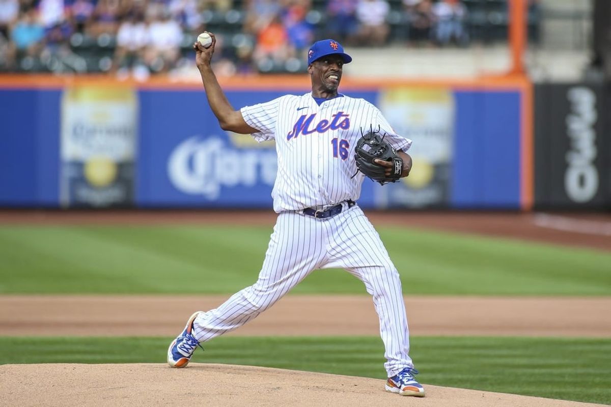 Aug 27, 2022; New York City, New York, USA;  Former Major League Baseball pitcher Dwight Gooden pitches at the New York Mets Old Timers Day game at Citi Field.