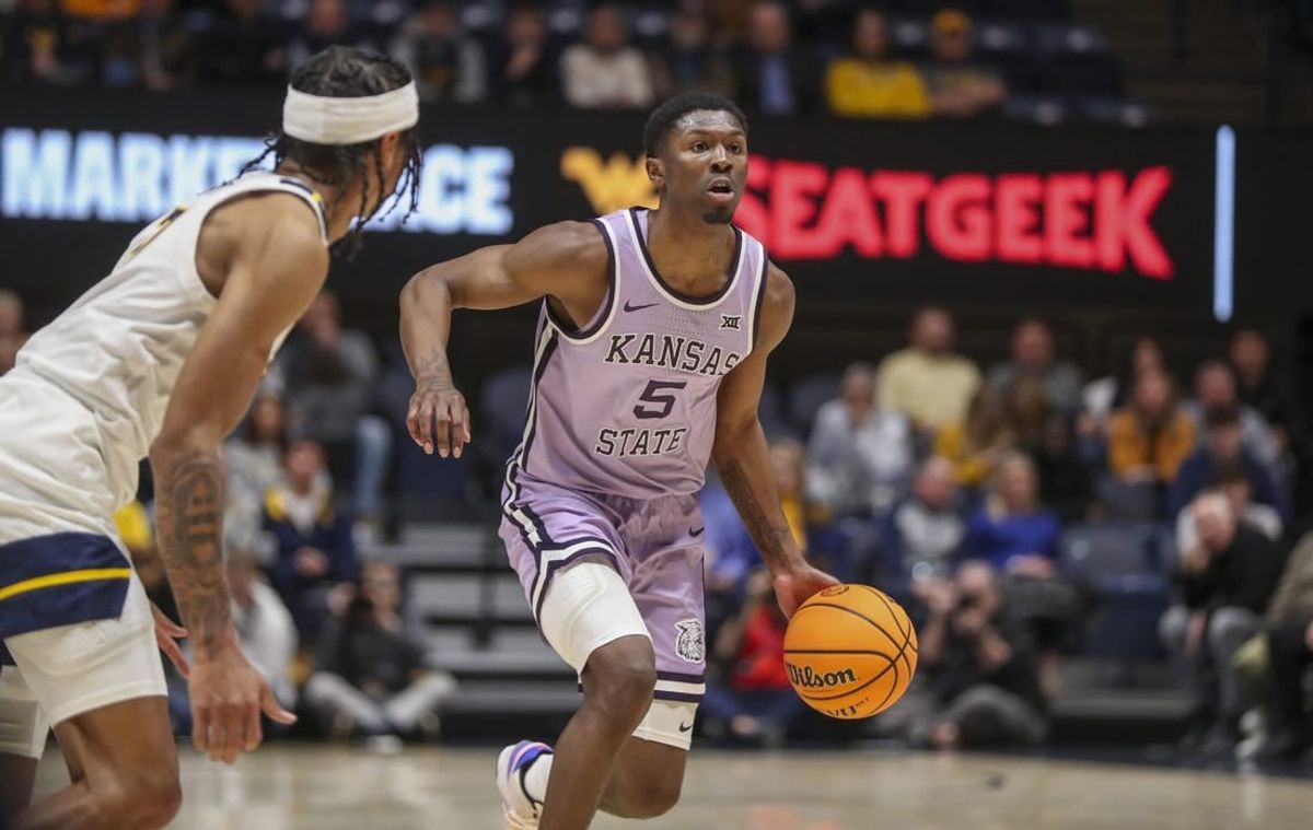 Jan 9, 2024; Morgantown, West Virginia, USA; Kansas State Wildcats guard Cam Carter (5) dribbles the ball during the first half against the West Virginia Mountaineers at WVU Coliseum.