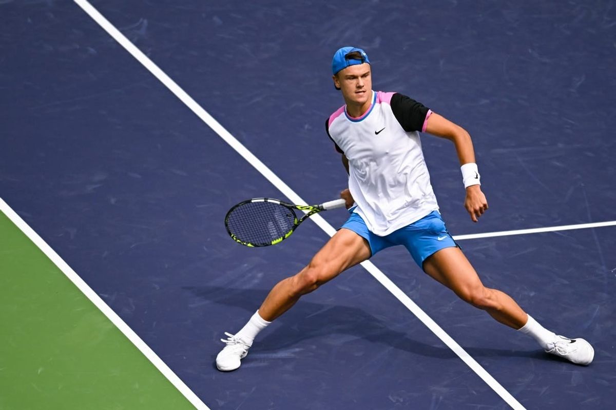 Mar 11, 2024; Indian Wells, CA, USA; Holger Rune (DEN) hits a shot in his third round match against Lorenzo Musetti (ITA) during the BNP Paribas Open at Indian Wells Tennis Garden.