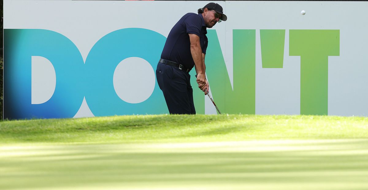 Should Phil Mickelson keep trying to put a positive spin on his LIV cash grab? The sign behind him has the answer.