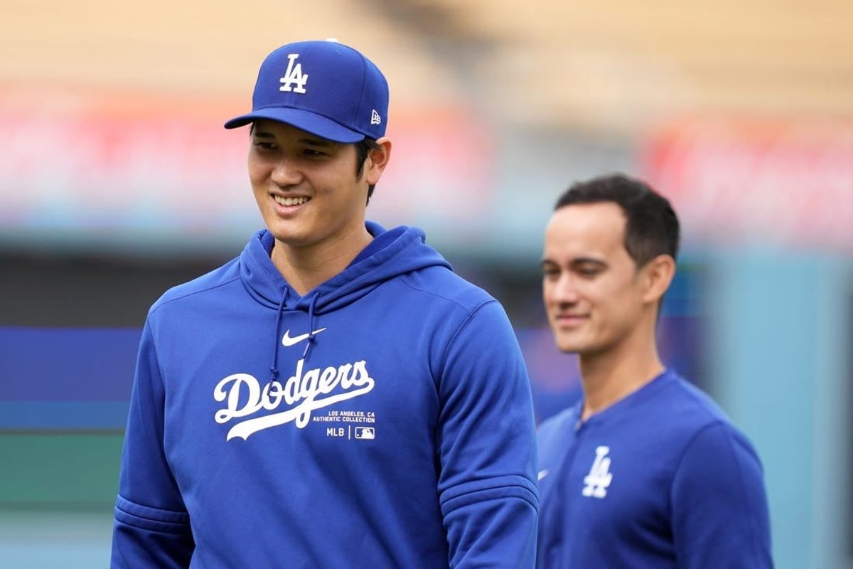 Mar 25, 2024; Los Angeles, California, USA; Los Angeles Dodgers designated hitter Shohei Ohtani (left) and interpreter Will Ireton before the game against the Los Angeles Angels at Dodger Stadium.
