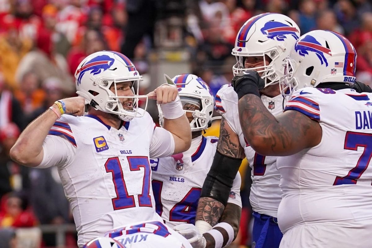 Dec 10, 2023; Kansas City, Missouri, USA; Buffalo Bills quarterback Josh Allen (17) celebrates with team mates after a score against the Kansas City Chiefs during the first half at GEHA Field at Arrowhead Stadium.