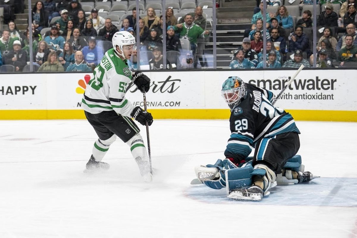 Mar 26, 2024; San Jose, California, USA; Dallas Stars center Wyatt Johnston (53) shoots and scores against San Jose Sharks goaltender Mackenzie Blackwood (29) during the first period at SAP Center at San Jose.